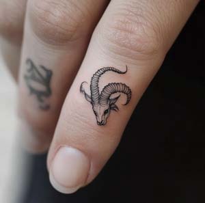 13. Capricorn Tattoo on Finger