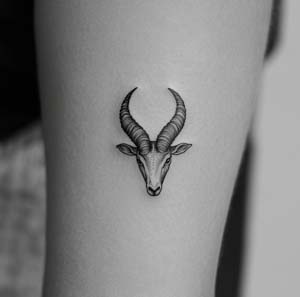 5. Tiny Capricorn Tattoo