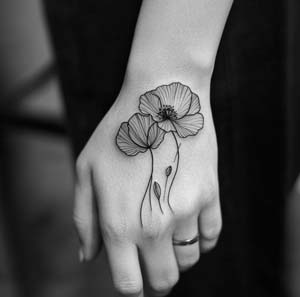 2_Twin_Poppies_tattoo_In_Fine_Lines_on_hand